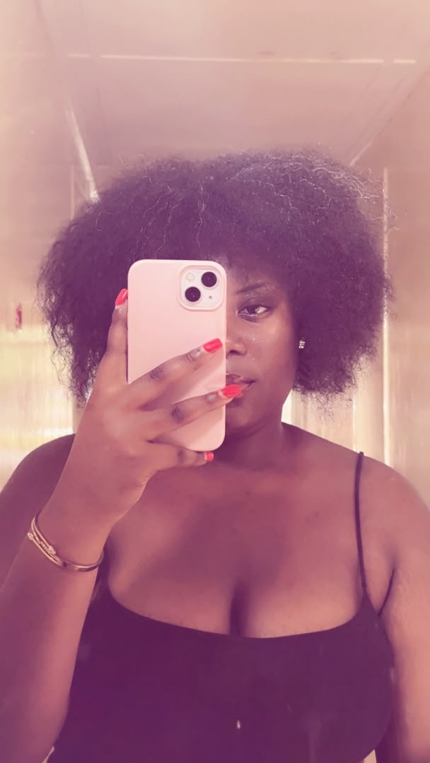 hair out, golden light catching her